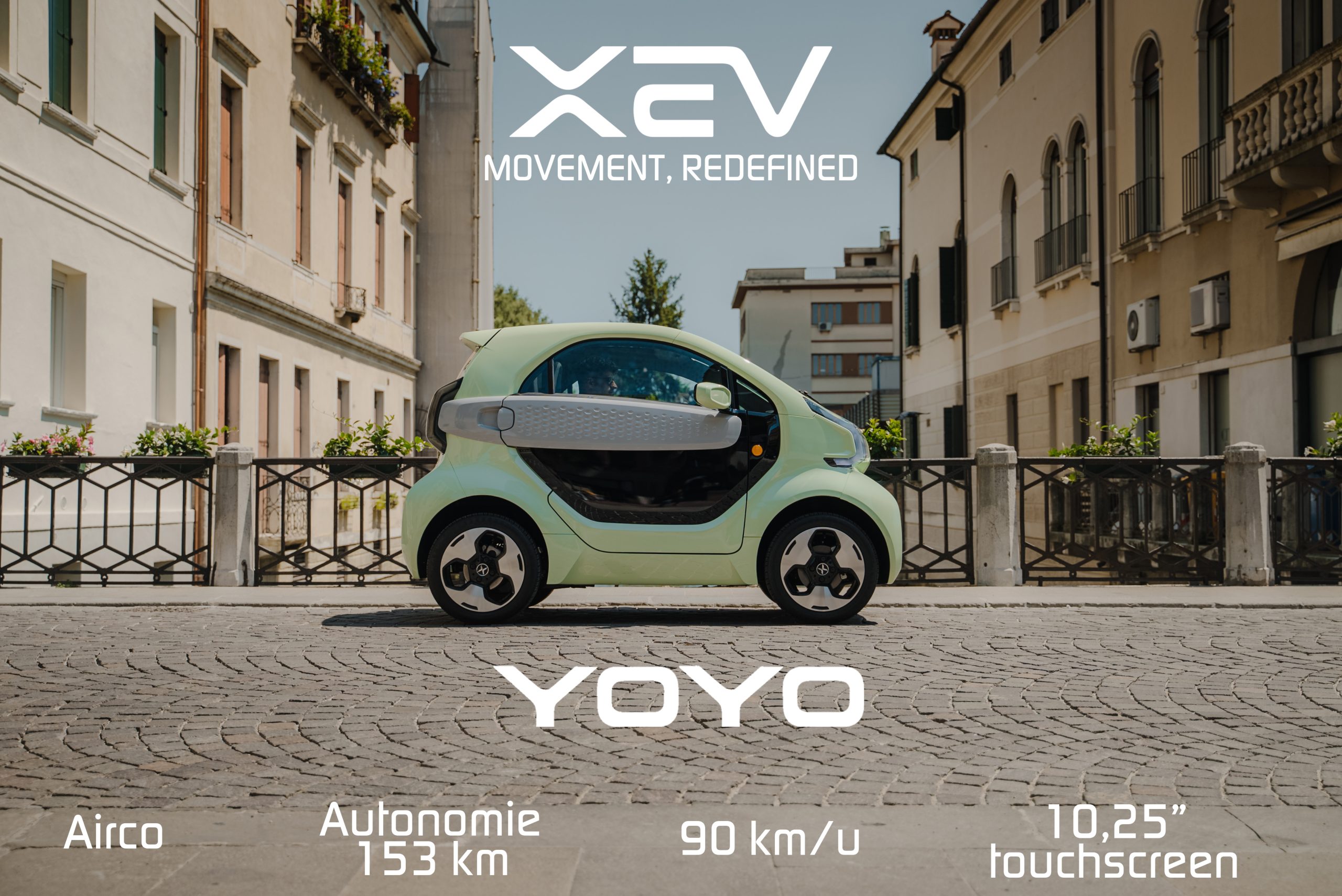 hero afbeelding van de xev yoyo pro in de kleur crushed mint rijdend over een brug met kasseien in de stad